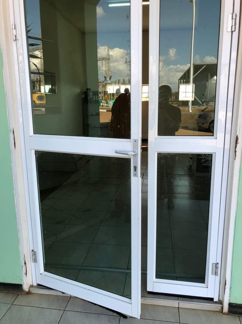 White aluminium glazed entrance with clear glass panels