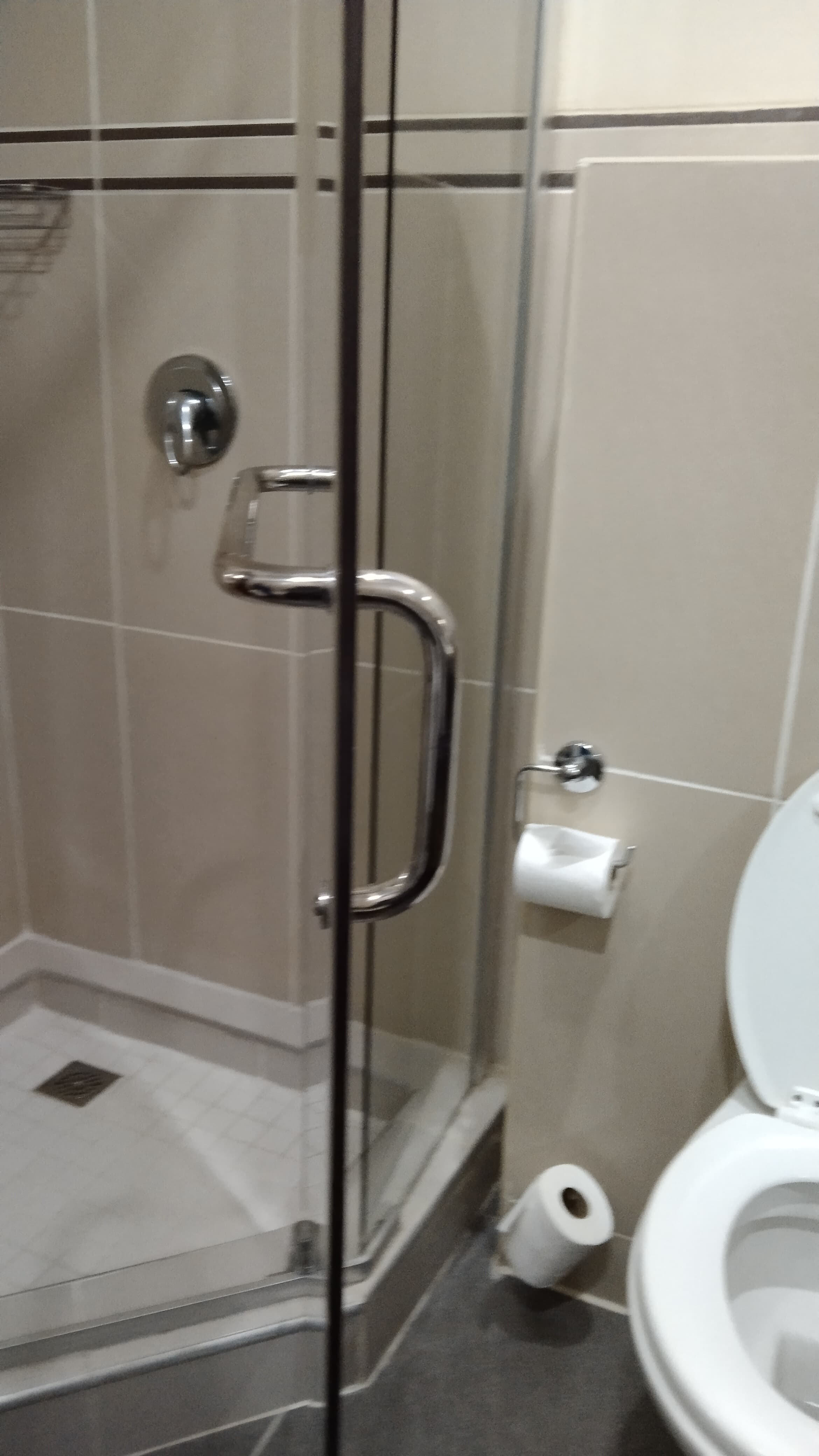 Custom-made shower enclosure with glass panels